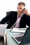 Businessman Busy On Phone Stock Photo