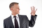 Businessman Counting Fingers Stock Photo