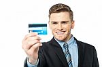 Businessman Displaying His Cash Card Stock Photo