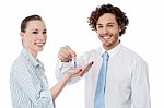 Businessman Handing Over The Key Stock Photo