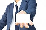 Businessman Hold Business Card Or White Card At Low Level Stock Photo