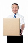 Businessman Holding A Carton Box Stock Photo