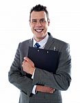 Businessman Holding A Clipboard Stock Photo