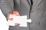 Businessman Holding Blank Jigsaw Stock Photo