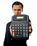 Businessman Holding Calculator Stock Photo