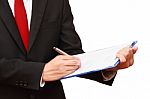 Businessman Holding Clipboard Stock Photo