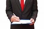 Businessman Holding Clipboard Stock Photo