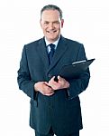 Businessman Holding Clipboard Stock Photo