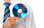 Businessman Holding Compact Disc Stock Photo