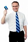 Businessman Holding Credit Card Stock Photo