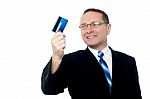 Businessman Holding Credit Card Stock Photo