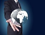 Businessman Holding Globe Stock Photo