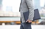 Businessman Holding Laptop Stock Photo