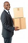 Businessman Holding Packed Cartons Stock Photo