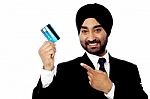 Businessman Holding Up Credit Card Stock Photo