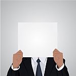 Businessman Holding White Blank Poster. Businessman Pointing At Banner Over White Stock Photo