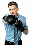 Businessman In Punching Posture Stock Photo