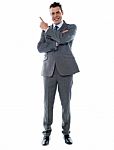 Businessman In Suit Pointing Stock Photo