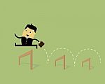 Businessman Jumping Over Hurdle Stock Photo