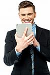 Businessman Operating Tablet Device Stock Photo