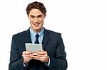 Businessman Operating Tablet Device Stock Photo