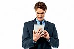 Businessman Operating Tablet Device Stock Photo