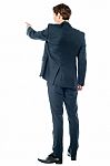 Businessman Pointing At Something Stock Photo