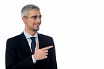 Businessman Pointing At Something Stock Photo