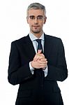 Businessman Posing With Clasped Hands Stock Photo