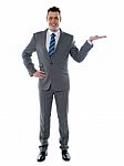 Businessman Presenting A Product Stock Photo