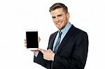 Businessman Presenting New Tablet Device Stock Photo