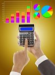 Businessman Pressing Calculator Stock Photo