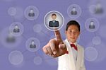 Businessman Pushing Human Button Stock Photo