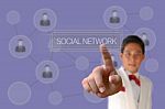 Businessman Pushing Social Network Button Stock Photo