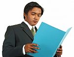 Businessman Reviewing Folder Stock Photo