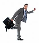 Businessman Running Away Stock Photo