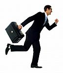 Businessman Running With Briefcase Stock Photo