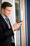 Businessman Sending Text Message Stock Photo