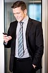 Businessman Sending Text Message Stock Photo