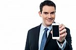 Businessman Showing A Mobile Phone Stock Photo