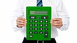 Businessman Showing Calculator Stock Photo