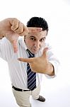 Businessman Showing Directing Gesture Stock Photo