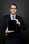 Businessman Showing Tablet Pc Stock Photo