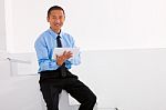 Businessman Sitting Stairs Holding Digital Tablet Stock Photo