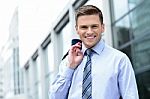 Businessman Standing Outside Modern Building Stock Photo