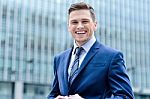 Businessman Standing Outside Modern Building Stock Photo