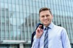 Businessman Standing Outside Modern Building Stock Photo