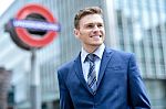 Businessman Standing Outside Modern Building Stock Photo