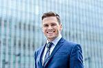 Businessman Standing Outside Modern Building Stock Photo