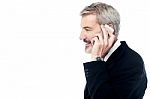 Businessman Talking On Phone Over White Stock Photo